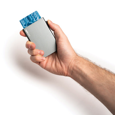 Pacsafe® RFIDsafe™ RFID blocking aluminum slider wallet (lifestyle)